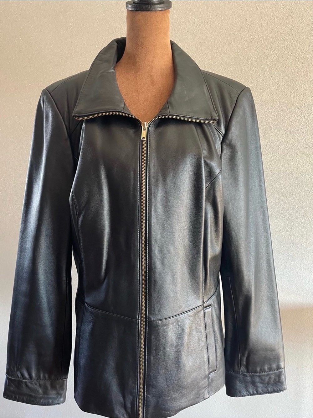 Denim & Co black genuine  leather jacket with gold zipper and pockets.